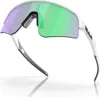 A pair of white Oakley Sutro Lite Sweep sunglasses with green and purple lenses, shown against a white background. Náhled obrázku produktu