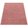 A pink shaggy rug is shown from a slightly elevated angle against a white background. Produktbild-Vorschau