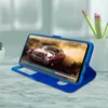 A blue flip cover for a Samsung Galaxy A71 phone is shown in a stand-up position, displaying a video of a red car. Pencils are visible in the background. Podgląd zdjęcia produktu