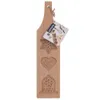 A wooden cookie mold with three different shapes carved into it: a star, a heart, and a bell. A small product information card is attached to the top. Náhľad obrázku produktu