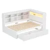 A white bed frame with integrated shelving and drawers, shown from a slightly elevated angle. Produktbild-Vorschau