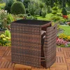 A wicker furniture set with a table and chairs is placed on a wooden deck in a garden setting. Anteprima dell’immagine prodotto