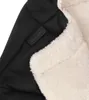 A close-up view of a black and cream colored fabric product, possibly a baby stroller accessory, with a label that reads 'MAXI COSI'. Produktbild-Vorschau