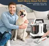 A man and his dog are sitting on the floor next to a carpet cleaner. Náhled obrázku produktu