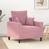 A pink velvet armchair is shown in a room with a plant and a side table. Anteprima dell’immagine prodotto