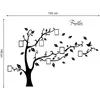 A black silhouette of a family tree wall decal with empty photo frames. Produktbild-Vorschau