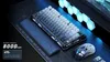 A gaming keyboard and mouse setup on a desk with ambient lighting. Produktbild-Vorschau