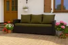 A sofa with green cushions is placed on a patio in front of a house, surrounded by potted plants. Produktbild-Vorschau