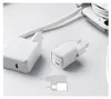 Two white Anker chargers and a white charging cable are arranged on a white surface, with a partial view of a smartphone in the background. Anteprima dell’immagine prodotto