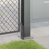 A close-up view of a metal post base and a chain-link fence. Produktbild-Vorschau