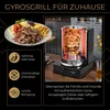 A Döner grill with a spit of meat cooking, next to a plate of prepared Döner meat, fries, and salad. Náhled obrázku produktu