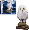 A 4D-build model of Hedwig from Harry Potter, shown both in its packaging and as a completed model. Produktbild-Vorschau
