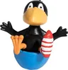A toy raven figure sitting in a blue bowl, holding a red and white striped object. Produktbild-Vorschau