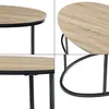 Collage of four close-up shots of a round coffee table with a wood-grain top and black metal legs. Produktbild-Vorschau