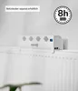 A white device is placed on top of a white radiator. Produktbild-Vorschau