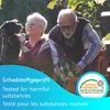 An elderly couple with two dogs in a garden. Produktbild-Vorschau