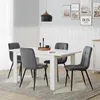 A dining room scene with a white table and four gray chairs. Produktbild-Vorschau