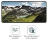 A smartphone screen displaying a mountain landscape, with two icons and text below. Produktbild-Vorschau