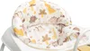 A close-up view of the padded seat of a baby walker with a dinosaur pattern. Produktbild-Vorschau