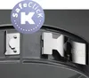 A close-up view of a springform cake pan's locking mechanism and a marketing graphic. Produktbild-Vorschau