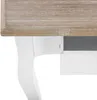 A close-up view of the corner of a white nightstand with a wooden top. Produktbild-Vorschau