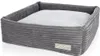 A grey corduroy dog bed with a light grey cushion inside, shown from a slightly elevated angle against a white background. Náhľad obrázku produktu