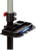 A close-up of a black dartboard stand accessory tray attached to a gray pole. Produktbild-Vorschau