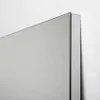 A close-up view of the corner of a mirror mounted on a wall. Anteprima dell’immagine prodotto