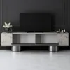 A modern TV stand with a television on top, set against a dark gray paneled wall. Voir les images du produit