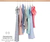 Clothes hanging on a wooden rod against a white background. Produktbild-Vorschau