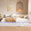A bedroom scene featuring a white upholstered bed with a beige comforter and pillows, a framed artwork on the wall, and a bedside table with a lamp in an arched niche. Produktbild-Vorschau
