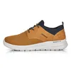 A side view of a brown and navy sneaker on a white background. Anteprima dell’immagine prodotto