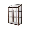 A mini greenhouse with wooden frame and clear polycarbonate panels, shown against a white background. Voir les images du produit