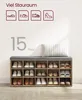 A shoe bench with a cushioned top, displaying multiple shoes organized in its compartments, placed against a plain wall. Produktbild-Vorschau