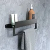 A bathroom shelf with toiletries and a towel. Anteprima dell’immagine prodotto