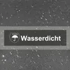 A close-up of a dark gray fabric with water droplets, featuring a dark rectangular badge with an umbrella icon and the German word "Wasserdicht" (waterproof). Produktbild-Vorschau