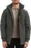A man wearing a gray winter jacket over a beige sweater.