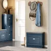 An entryway with a shoe cabinet, bench, and coat rack. Náhled obrázku produktu