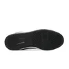 The underside of a black and white sneaker is shown against a white background. Náhled obrázku produktu