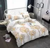 A bedroom scene with a bed dressed in dandelion-themed bedding. Podgląd zdjęcia produktu