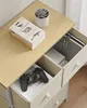 A close-up overhead view of a chest of drawers with some items on top and inside. Produktbild-Vorschau
