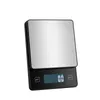 A digital kitchen scale with a stainless steel weighing surface and a black base. Voir les images du produit