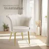 A cream-colored armchair with gold legs is shown in a well-lit room with soft lighting and curtains. Produktbild-Vorschau