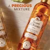 Two bottles of Tesori d'Oriente shower oil are displayed on a wooden surface, with text overlays. Anteprima dell’immagine prodotto