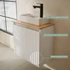 A modern bathroom vanity with a sink and faucet. Produktbild-Vorschau
