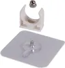 A white plastic clip and a silver nut, along with a square clear adhesive backing with a screw. Anteprima dell’immagine prodotto