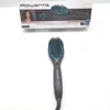 A Rowenta Power Straight hair straightening brush is shown in front of its packaging. Produktbild-Vorschau