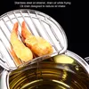 A close-up shot of a stainless steel oil strainer with fried shrimp and oil. Náhled obrázku produktu