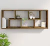 A brown wooden wall shelf with several compartments is mounted on a white wall. Some items are displayed on the shelves, including books, a potted plant, decorative spheres, and a framed picture. Anteprima dell’immagine prodotto