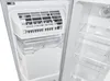 Interior view of a refrigerator or freezer, showing an ice maker and storage shelves. Podgląd zdjęcia produktu